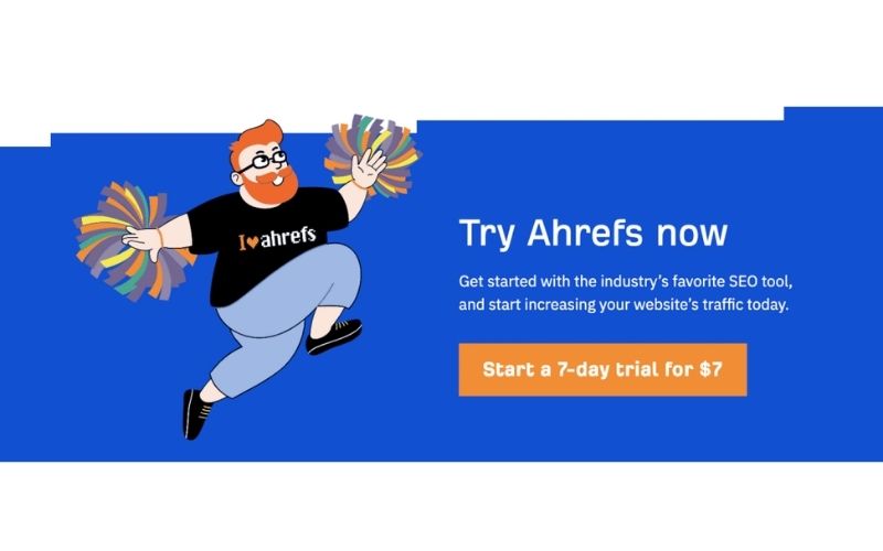 一个红发的卡通人物,手持彩色拉拉花,穿着印有“I ❤️ ahrefs”字样的T恤,上面有关于Ahrefs工具的宣传文字,右侧有“Start a 7-day trial for $7”的橙色按钮。