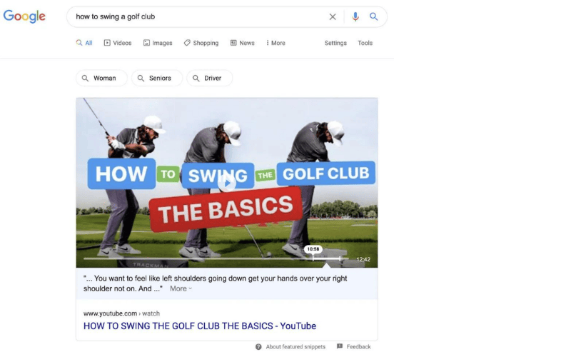Google搜索结果页面，展示“How to swing a golf club”的相关视频，精选内容为YouTube教程，标题为“如何挥杆高尔夫球杆：基础知识